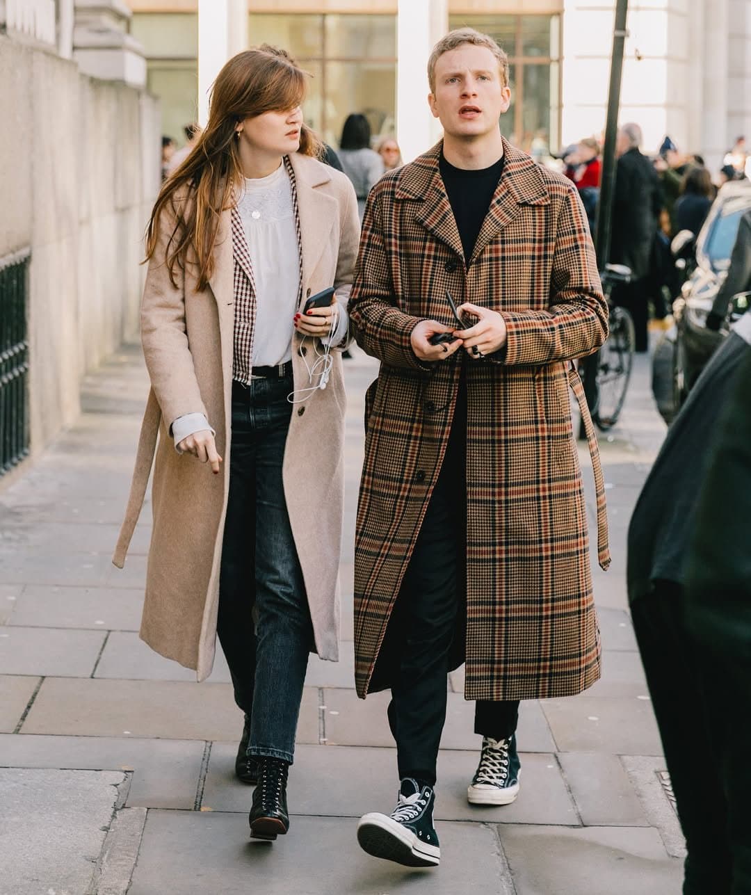 Two long coats rehearse
casualness too well.