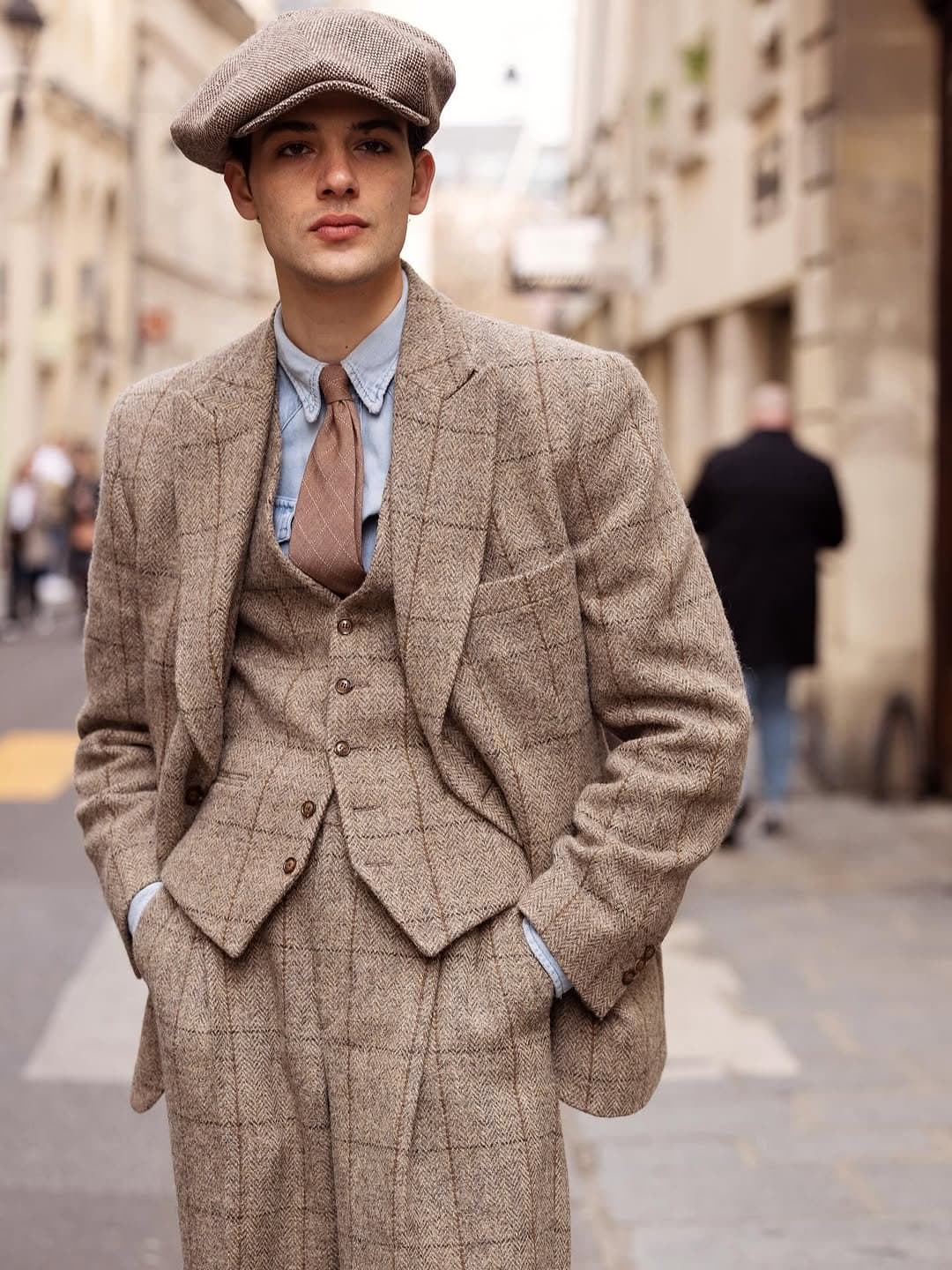 That cap arrives first,
and the suit follows.