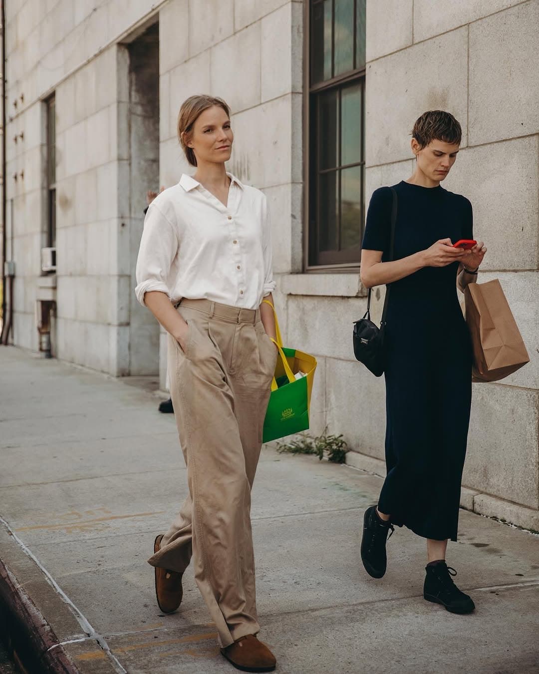 The green bag breaks
all that beige discipline.