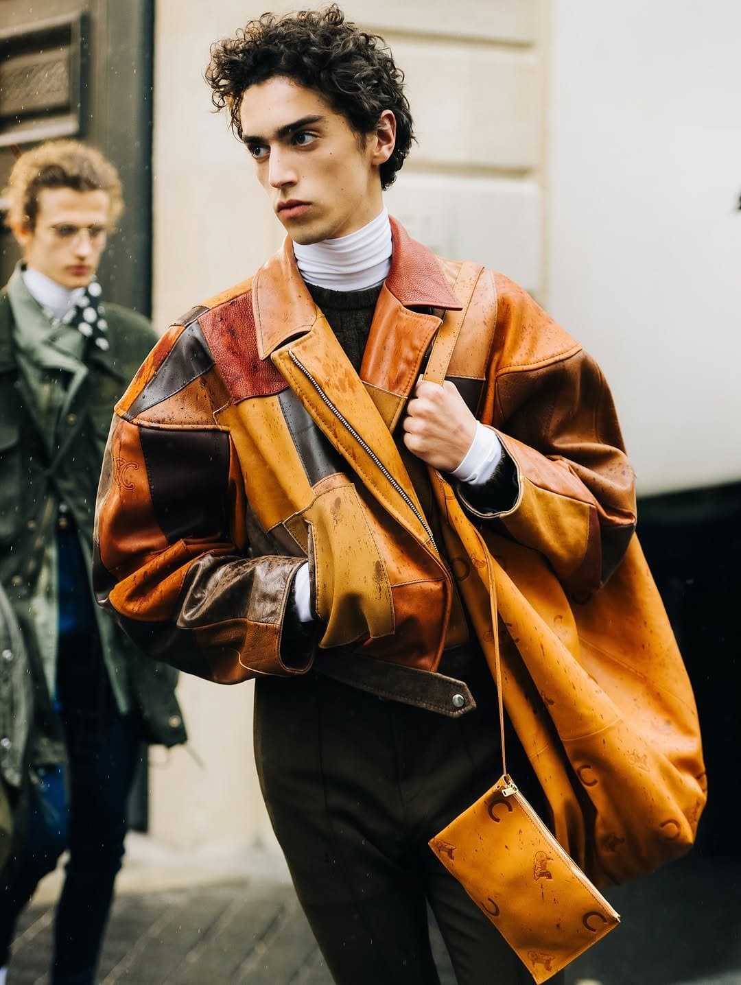 The jacket has authority.
The bag overplays it.
