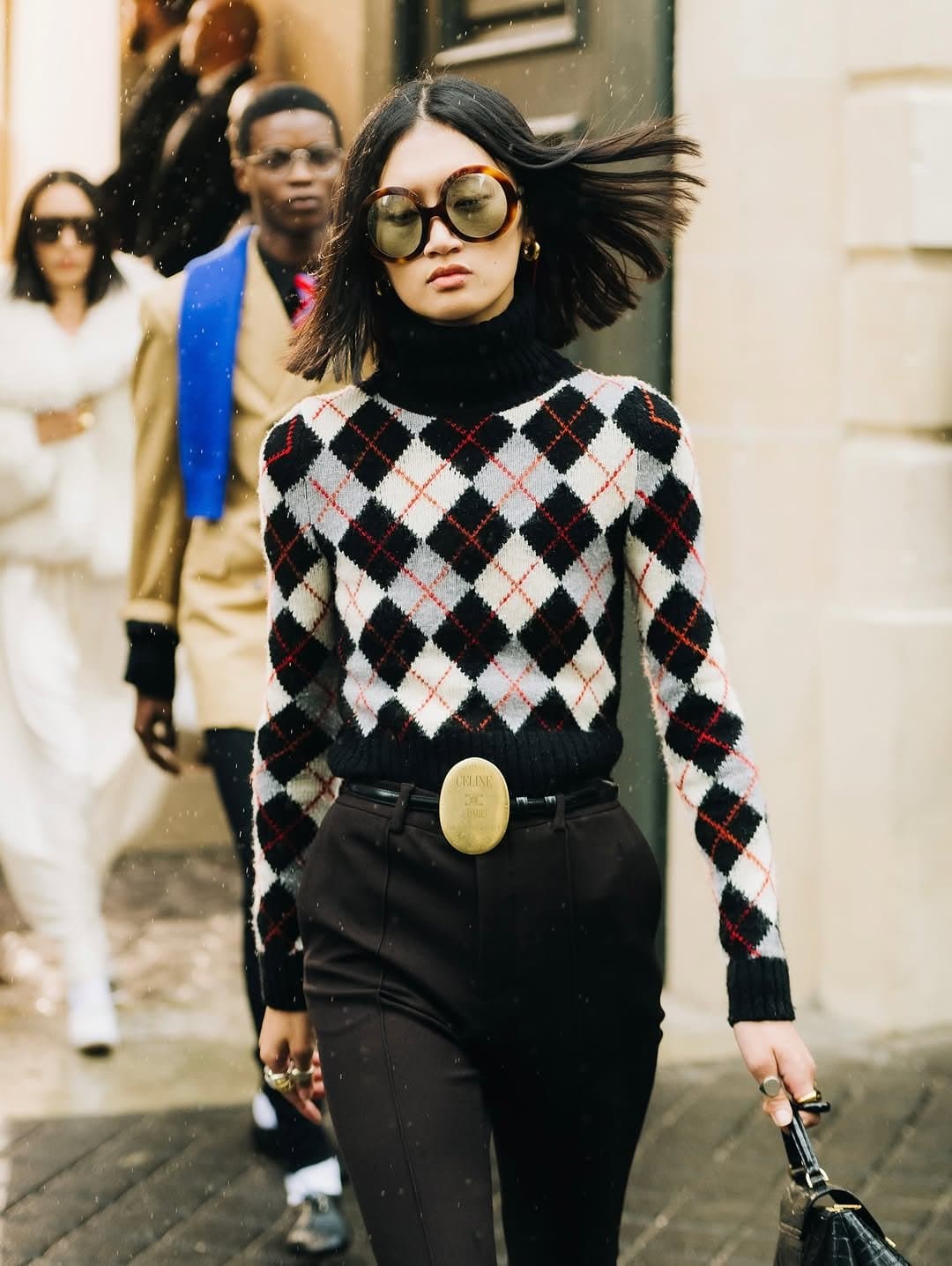 Preppy argyle walks in,
one loud gold full stop.