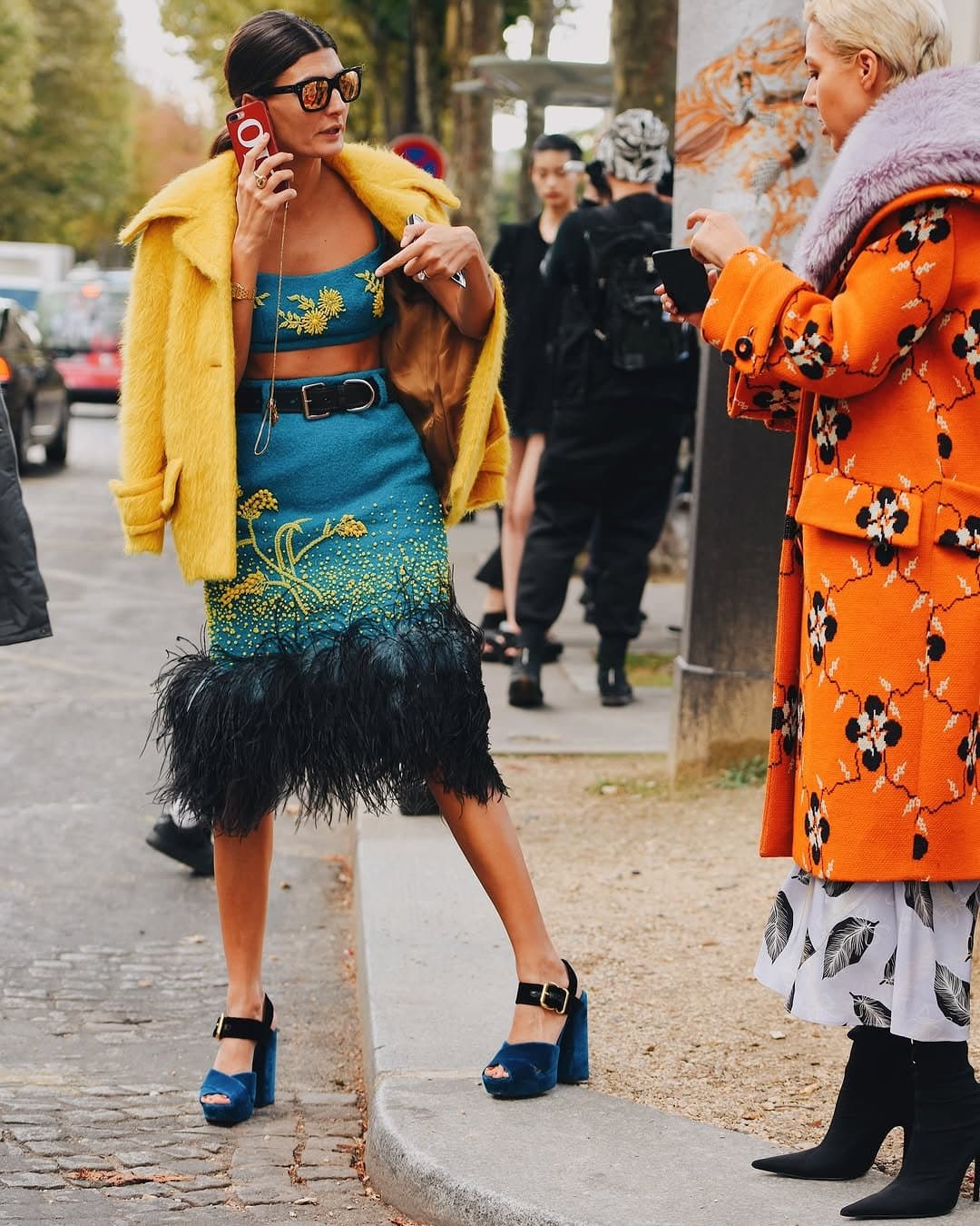 The coat and feather hem
need that hard waist.