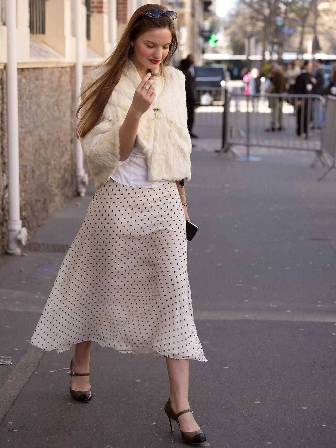 The cropped fur earns the waist,
then the dots do the walking.