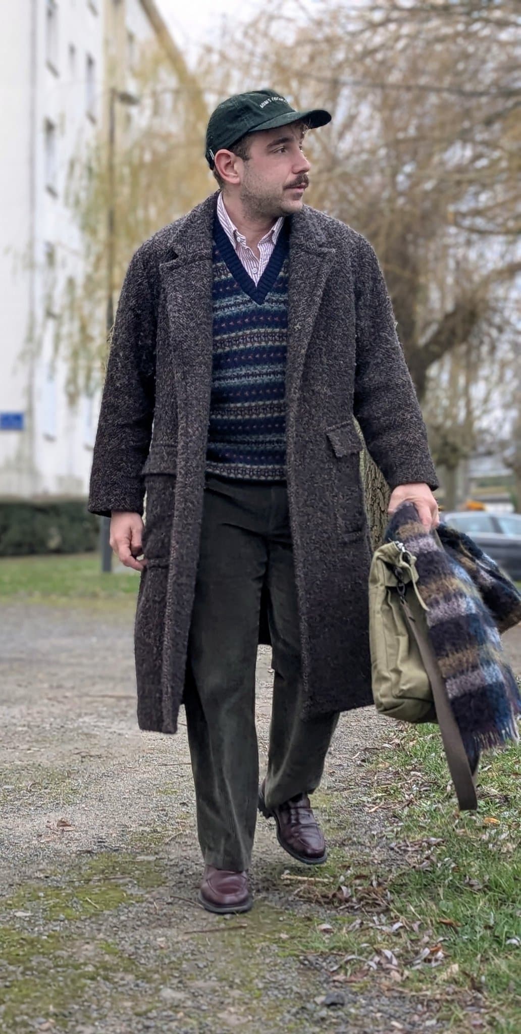 The black cap saves tweed
from costume history class.
