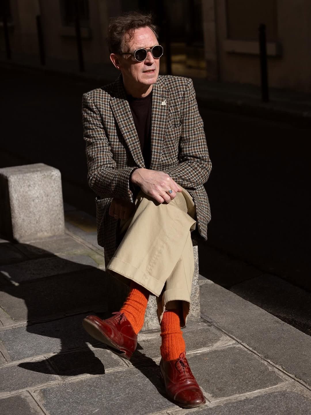 The socks save the tweed
from museum duty.