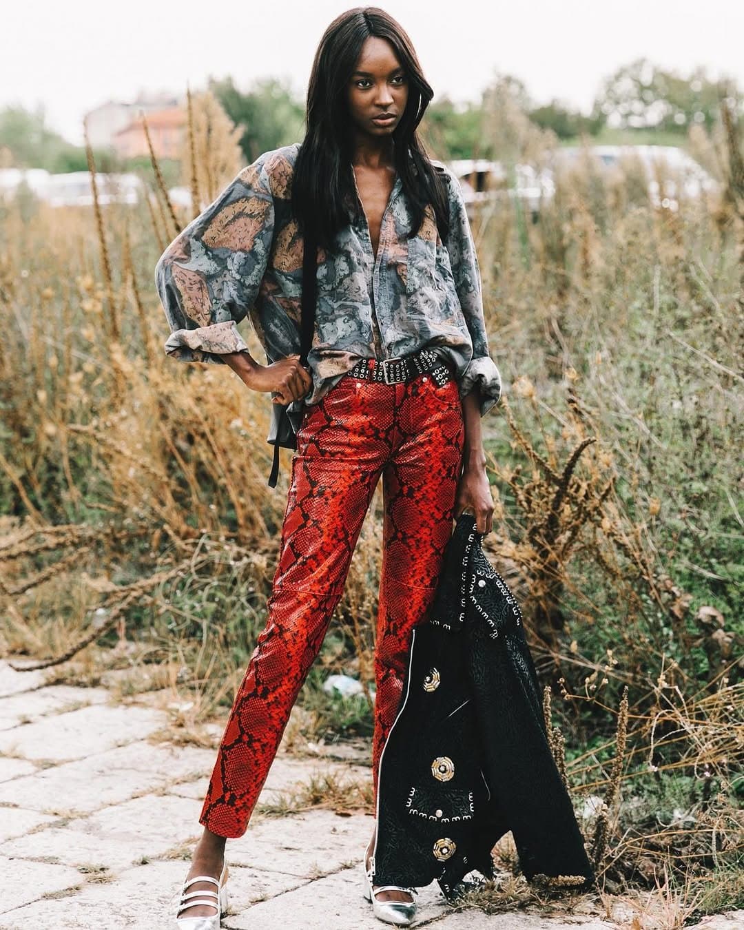 The snakeskin wins,
because the shirt backs down.