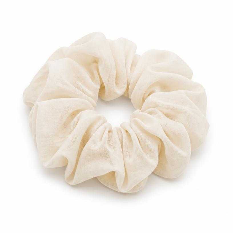 Generated item image of cream gathered fabric scrunchie